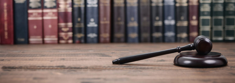 a dark wooden gavel placed on a table