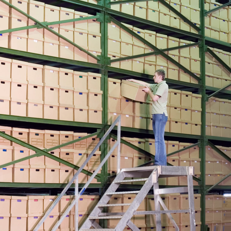 Man working on the stairs in the warehouse